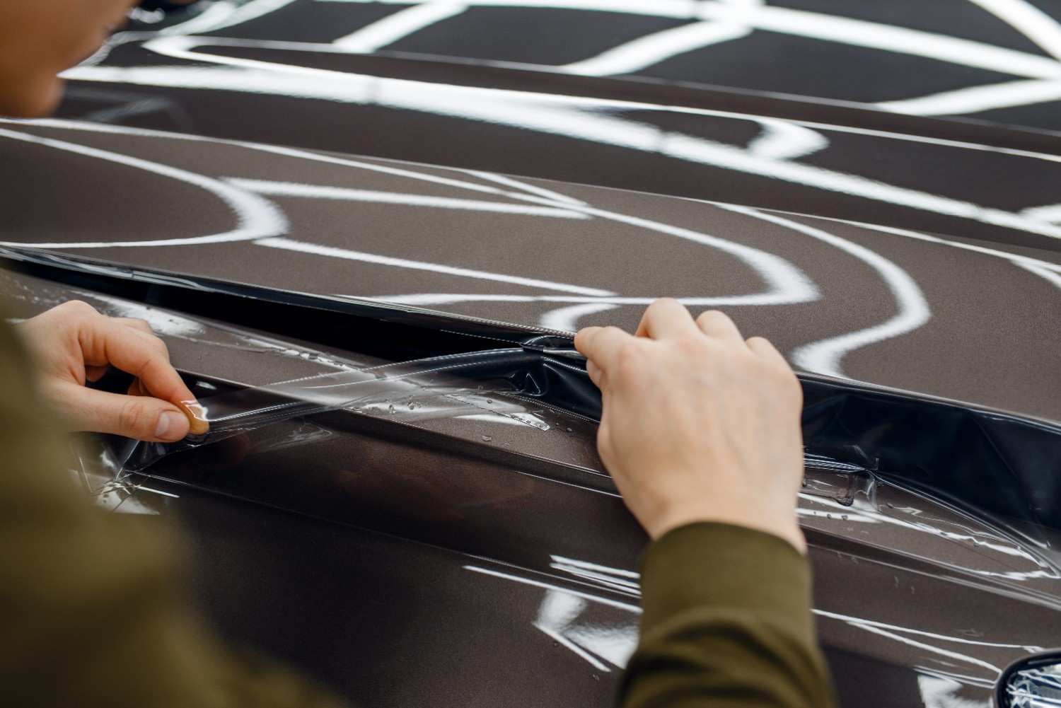 worker-installs-protection-film-on-car-hood-2024-12-02-09-30-29-utc-1-.jpg